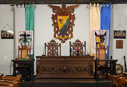 Ornate carved wooden platform in the unique Grey Whale Castle event venue in San Diego